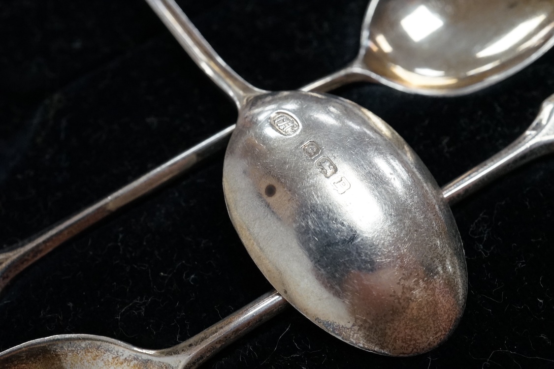 Three assorted silver christening sets including spoon, fork and napkin ring by William Hutton & Sons, London, 1896, one other set with steel knife, two cased sets of silver coffee spoons and a cased set of six Japanese
